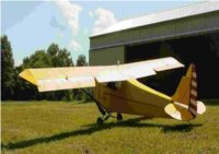 fisher 202 in front of hangar